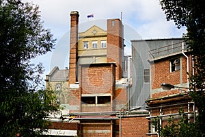 Beautiful shot of a building in South Hobart in Australia with the Australian flag on the roof