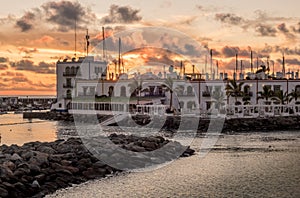 Beautiful shot of buildings and a sea in Puerto de Mogan Canary Islands in Spain at sunset photo