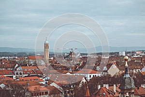 Beautiful shot of buildings with a tower in the distance in Deutschland