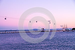 Beautiful shot of cable cars over the Tagus River in Spain during sunset