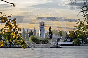 Beautiful shot of the coast with a lighthouse near Sylvan Lake in Alberta, Canada