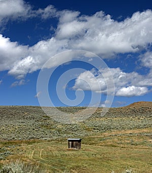 Beautiful shot of construction in the landscape of hills under a cloudy sky in Montana USA