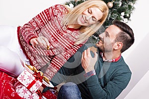 Beautiful shot of a couple enjoying each other`s accompaniment on Christmas holidays