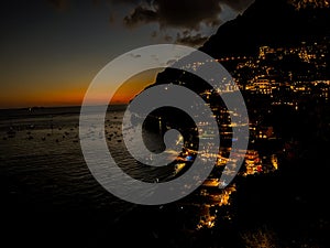 Beautiful shot of a dark sunset sky over the shore of Positano, Amalfi Coast, Italy