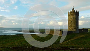 Beautiful shot of the Doonagore Castle and the sea in Doolin, Ireland