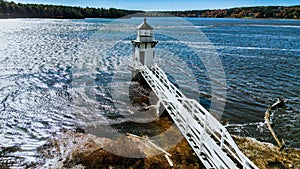 Beautiful shot of Doubling Point Lighthouse on Kennebec River in Bath, Maine on sunny day photo