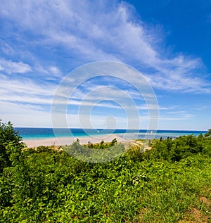 Beautiful shot of Elberta beach with wispy clouds