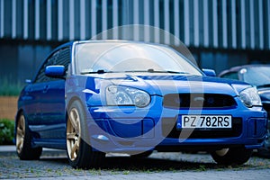 Beautiful shot of the front part of blue Subaru Impreza WRX Blobeye