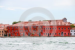 Beautiful shot of the historic Residenza Grandi Vedute building across the water in Venice, italy photo