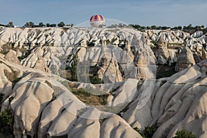 Beautiful shot of the hot air balloons over a landscape in the Cappadocia area in Turkey