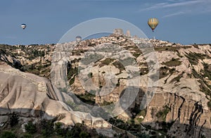 Beautiful shot of the hot air balloons over a landscape in the Cappadocia area in Turkey