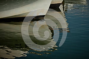 Beautiful shot of hulls of two old boats docking in Saint Michaels, Maryland harbor