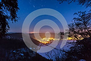 Beautiful shot of an illuminated cityscape in the night sky full of stars