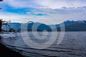 Beautiful shot of a lake surrounded by forested mountains