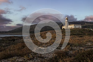 Beautiful shot of the Larino Lighthouse on a hill In Galicia Spain photo