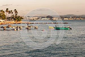 Beautiful shot of little fishing boats moored in the pier in tropical island at sunny afternoon