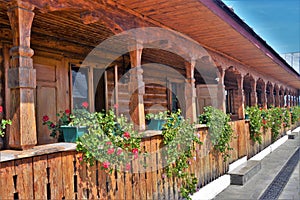 Beautiful shot of long verandah of a wooden house with plants and flowers