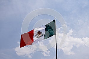 Beautiful shot of Mexican flag buoying under the blue sky