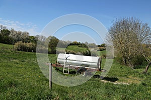 Beautiful shot of a mobile water tank in a rural field