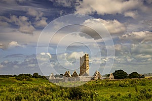 Beautiful shot of Moyne Abbey Ruins in County Mayo, Ireland under the cloudy blue sky