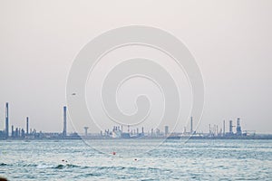 Beautiful shot of the Navodari refinery visible from a beach in Romania