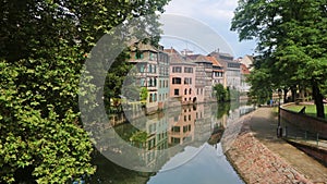 Beautiful shot of a neighborhood of colorful apartment buildings near the river in Strasburg, France