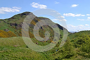 Beautiful shot of people in Arthur`s Seat in Edinburgh, Scotland