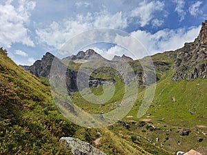 Beautiful shot of the rocky green mountains under a bright sky in Korab, North Macedonia