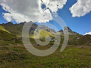 Beautiful shot of the rocky green mountains under a bright sky in Korab, North Macedonia