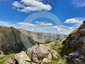 Beautiful shot of the rocky green mountains under a bright sky in Korab, North Macedonia
