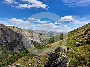 Beautiful shot of the rocky green mountains under a bright sky in Korab, North Macedonia