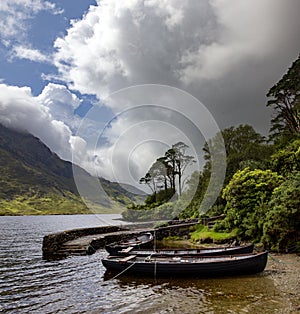 Beautiful shot of rowing boats in the river of Doo Lough, County Mayo in Ireland