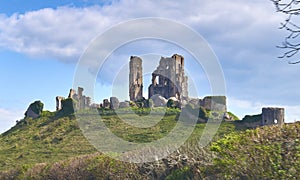 Beautiful shot of the ruins of Corfe Castle under blue sky and white clouds