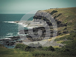 Beautiful shot of a rural green valley on the shore in Kiama, Australia