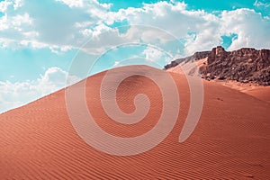 Beautiful shot of sand dunes under a bright sky on the desert in