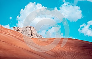 Beautiful shot of sand dunes under a bright sky on the desert in Dubai, UAE
