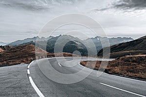 Beautiful shot of a scenic alpine road with a view of mountains in Austria