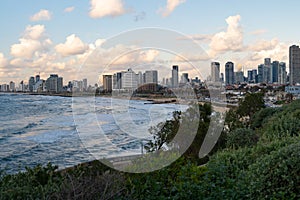 Beautiful shot of a sea, beach, and  the Tel Aviv city buildings in Yaffo Israel