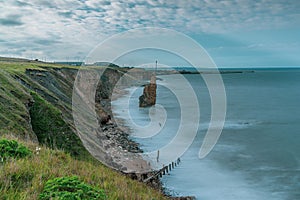 Beautiful shot of the Sea Stack on Chemical Beach near Seaham Harbour under a cloudy sky
