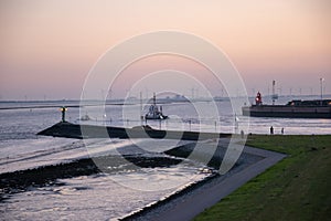 Beautiful shot of a seashore with boats during a sunset