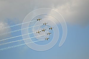 Beautiful shot of seven warplanes in the sky going in the same direction.