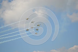 Beautiful shot of seven warplanes in the sky going in the same direction.