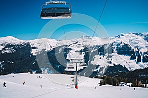 Beautiful shot of ski lifts and cable cars in Saalbach ski resort during winter time