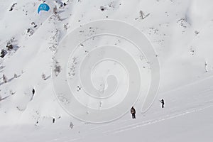 Beautiful shot of a skier practicing kite skiing at the mountain pass in Simplon, Switzerland