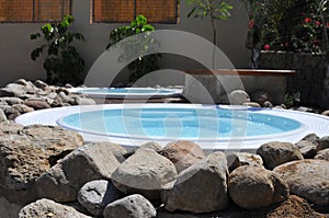 Beautiful shot of small round inground swimming pools under the sunlight