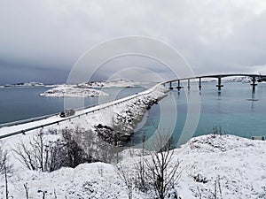 Beautiful shot of the snowy Sommaroy Bridge connecting the islands of Kvaloya and Sommaroy