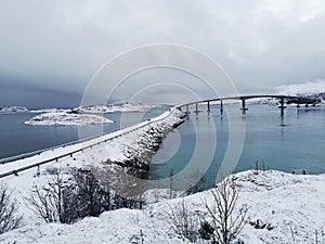 Beautiful shot of the snowy Sommaroy Bridge connecting the islands of Kvaloya and Sommaroy