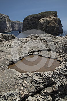 Beautiful shot of stunning rocky landscape surrounding Dwejra Bay, Malta