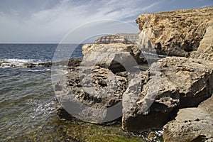 Beautiful shot of stunning rocky landscape surrounding Dwejra Bay, Malta