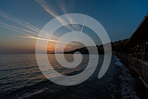 Beautiful shot of the sun rising over the beach on a breezy autumn day in Lesbos